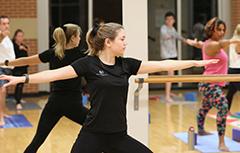 Instructor leading yoga class